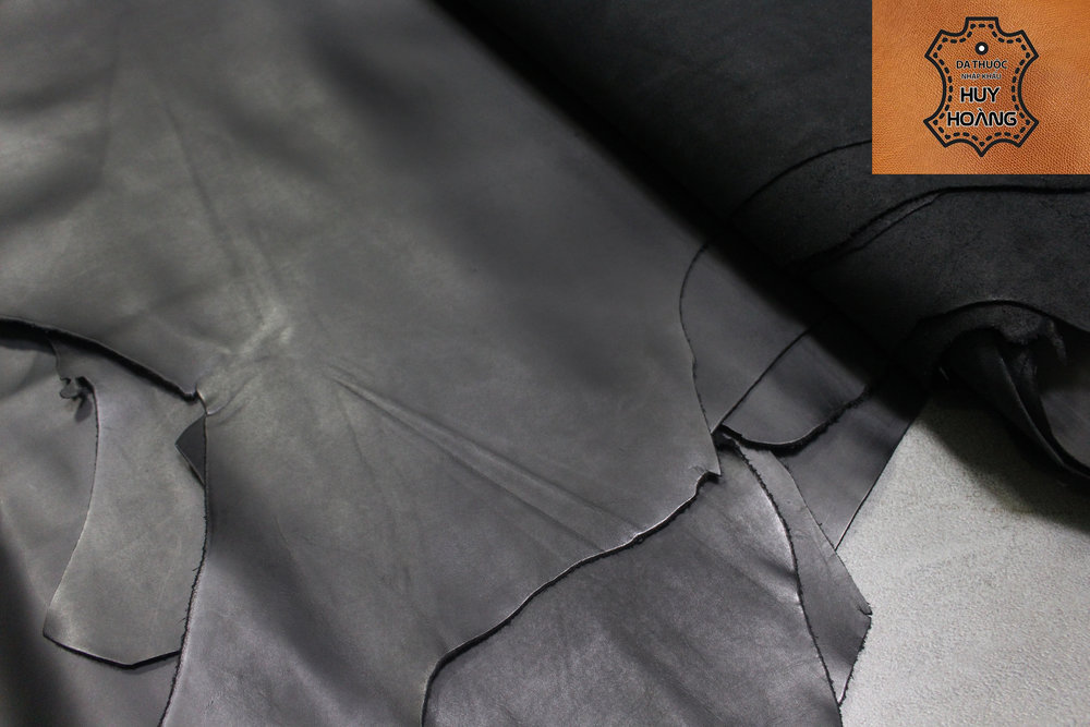 ban-tam-da-bo-den-tron-nhap-khau-huy-hoang-01 Tấm thuộc da bò màu đen trơn thuộc da huy hoàng 001